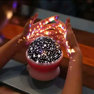 Lámpara Proyector de Estrellas LED Infantil Luz Nocturna Giratoria